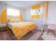 Cheerful bedroom with yellow bedding and accents, creating a sunny and inviting atmosphere at 7799 Pecos St, Denver, CO 80221