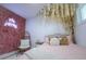 Cozy bedroom featuring a floral wall and hanging vines, creating a whimsical and inviting space at 7799 Pecos St, Denver, CO 80221