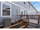 View of the backyard with raised garden beds and wooden deck with railing at 5779 Ceylon St, Denver, CO 80249