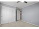 Bedroom boasts natural light, double closet, and neutral paint at 5779 Ceylon St, Denver, CO 80249