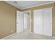 Bedroom features plush carpet, white trim, and sliding door closet at 5779 Ceylon St, Denver, CO 80249