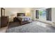 Comfortable bedroom with plush carpeting, ample natural light, and a well-lit ambiance at 10525 Hobbit Ln, Westminster, CO 80031