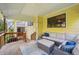 Relaxing covered deck featuring comfortable seating and pleasant outdoor ambiance at 10525 Hobbit Ln, Westminster, CO 80031