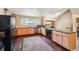 Well-equipped kitchen featuring stainless steel appliances, wooden cabinetry, and ample counter space at 10525 Hobbit Ln, Westminster, CO 80031