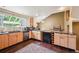 Bright kitchen with hardwood floors, granite countertops, stainless steel appliances and custom wood cabinets at 10525 Hobbit Ln, Westminster, CO 80031