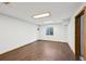Bright living space with wood floors, natural light, and white walls offers a flexible design at 10525 Hobbit Ln, Westminster, CO 80031