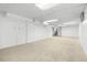 Spacious finished basement features neutral carpeting, white walls, and ample storage space at 2575 Quail St, Lakewood, CO 80215