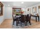 Inviting dining room featuring wood floors, a modern table setting, and natural light at 2575 Quail St, Lakewood, CO 80215