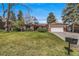 Charming ranch-style home with well-manicured lawn and mature trees in a peaceful neighborhood at 2575 Quail St, Lakewood, CO 80215