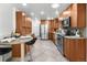 Well-appointed kitchen featuring stainless steel appliances, a breakfast bar, and a tile floor at 2575 Quail St, Lakewood, CO 80215