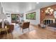 Cozy living room featuring a decorative brick fireplace and wood-framed glass patio doors to the outside at 2575 Quail St, Lakewood, CO 80215