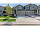 Beautiful home featuring a two-car garage, manicured lawn, and inviting front porch at 17825 Gallup St, Broomfield, CO 80023