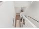Entryway featuring plank flooring, a hall bathroom and coat closet at 17825 Gallup St, Broomfield, CO 80023