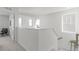 Upstairs hallway features natural light and neutral decor at 17825 Gallup St, Broomfield, CO 80023