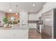 Stylish kitchen with granite countertops, stainless steel appliances, and a dining area at 17825 Gallup St, Broomfield, CO 80023
