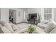 Bright living room with modern decor, large windows, and comfortable seating arrangements at 17825 Gallup St, Broomfield, CO 80023