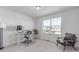 Functional office with a sleek desk, comfortable chair, and a window offering natural light at 17825 Gallup St, Broomfield, CO 80023