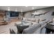 This basement has a comfortable seating area and fireplace perfect for relaxing at 5145 S Logan Dr, Littleton, CO 80121