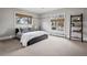 Bright bedroom with a comfortable bed, natural light from two windows, and tasteful decor, creating a cozy atmosphere at 5145 S Logan Dr, Littleton, CO 80121