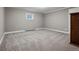 Bedroom features neutral carpet, and a large window with bright, natural light at 5145 S Logan Dr, Littleton, CO 80121