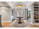 Inviting foyer with hardwood floors, a decorative table, and a view of the living spaces beyond at 5145 S Logan Dr, Littleton, CO 80121