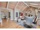 Bright living room boasts vaulted ceilings, a stone fireplace, and an open layout at 5145 S Logan Dr, Littleton, CO 80121