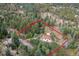 Aerial view of property surrounded by dense forest at 11827 Brook Rd, Golden, CO 80403