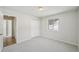 Bright bedroom featuring a window, carpeted floors, and a closet at 574 El Paso Rd, Palmer Lake, CO 80133