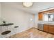 Bright kitchen with hardwood floors, stainless steel appliances, and a cozy breakfast bar area at 574 El Paso Rd, Palmer Lake, CO 80133