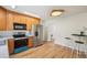Updated kitchen featuring stainless steel appliances, modern cabinets, and a stylish breakfast nook at 574 El Paso Rd, Palmer Lake, CO 80133