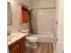 Bathroom featuring a bathtub and shower combo, vanity with sink, and medicine cabinet at 769 S Youngfield Ct, Lakewood, CO 80228