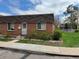 Charming brick home featuring a well-maintained lawn and beautiful landscaping around the property at 769 S Youngfield Ct, Lakewood, CO 80228