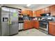 Functional kitchen featuring stainless steel appliances and ample cabinet space for culinary adventures at 1390 S Ammons St, Lakewood, CO 80232
