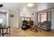 Inviting living room with hardwood floors, complemented by natural light and comfortable seating options at 1390 S Ammons St, Lakewood, CO 80232
