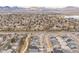 Elevated aerial view captures a residential area near a lake and major roadway, with mountain views at 4644 S Kipling Cir, Littleton, CO 80123