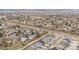 Wide aerial view of a vibrant suburban neighborhood, showcasing orderly streets and proximity to the mountains at 4644 S Kipling Cir, Littleton, CO 80123