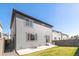 The gray siding of the home complements the well-maintained lawn, offering a serene outdoor space at 4644 S Kipling Cir, Littleton, CO 80123