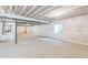 Unfinished basement with exposed ceilings, plumbing, and concrete floor provides space for customization at 4644 S Kipling Cir, Littleton, CO 80123