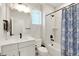 Clean bathroom with white vanity, modern fixtures, and a shower-tub combo offers comfort and style at 4644 S Kipling Cir, Littleton, CO 80123