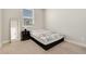 Cozy bedroom with a comfortable bed, a full length mirror, and a window at 4644 S Kipling Cir, Littleton, CO 80123
