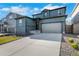 Charming two-story home featuring a two-car garage and a well-maintained front yard at 4644 S Kipling Cir, Littleton, CO 80123