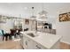 Bright, open kitchen and dining area with an island and stainless steel appliances at 4644 S Kipling Cir, Littleton, CO 80123