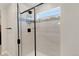 Modern shower with black trim and white subway tile at 4644 S Kipling Cir, Littleton, CO 80123