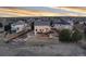 Backyard aerial view of home with a large deck, landscaping, and neighborhood homes at 7360 Almandine Ct, Castle Rock, CO 80108