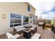 Spacious back deck featuring outdoor seating and a fire pit, perfect for entertaining guests and relaxing outdoors at 7360 Almandine Ct, Castle Rock, CO 80108