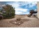Spacious backyard featuring a two-story deck and professional landscaping at 7360 Almandine Ct, Castle Rock, CO 80108