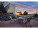 Backyard with outdoor seating area, a firepit, and a view of the sunset at 7360 Almandine Ct, Castle Rock, CO 80108