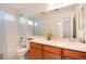 Bathroom with a single vanity, shower-tub combo, and large mirror at 7360 Almandine Ct, Castle Rock, CO 80108