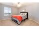 Bedroom with a window and ceiling fan; neutral color scheme at 7360 Almandine Ct, Castle Rock, CO 80108