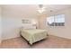 Bedroom with a window and ceiling fan; bright and airy at 7360 Almandine Ct, Castle Rock, CO 80108